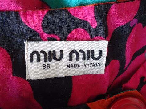 fake miu miu t shirt|How to spot fake Miu Miu T shirt. Real vs fake Miu Miu shirt.